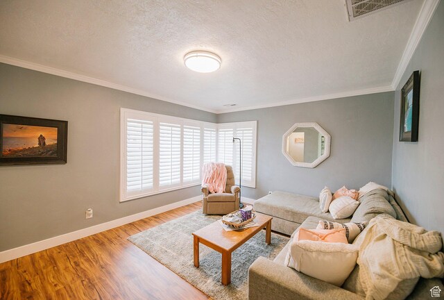 663 W 3500 S, Bountiful, UT 84010 - living room featuring visible vents, a textured ceiling, baseboards, and wood finished floors