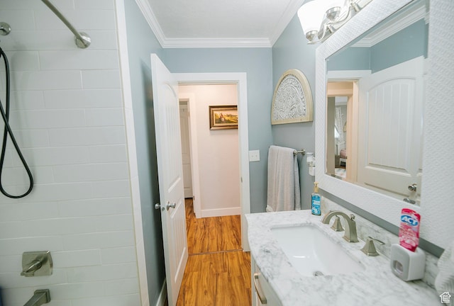 663 W 3500 S, Bountiful, UT 84010 - bathroom with wood finished floors, shower / washtub combination, baseboards, vanity, and ornamental molding