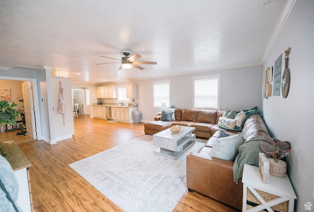663 W 3500 S, Bountiful, UT 84010 - living room with baseboards, ornamental molding, light wood-style flooring, and ceiling fan