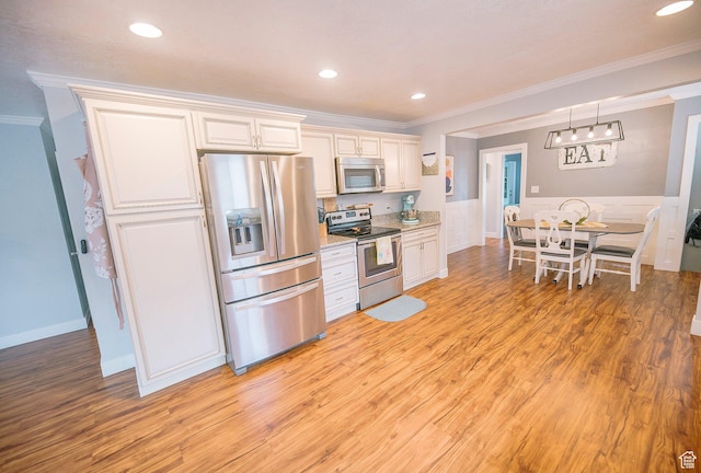 663 W 3500 S, Bountiful, UT 84010 - kitchen with stainless steel appliances, recessed lighting, ornamental molding, and light wood-type flooring