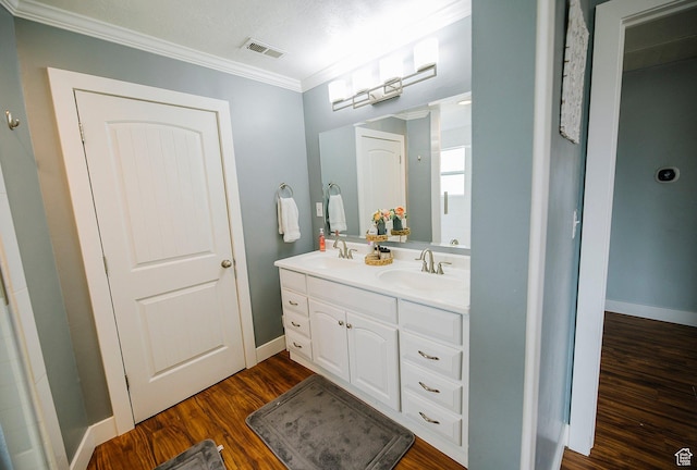 663 W 3500 S, Bountiful, UT 84010 - full bath featuring a sink, baseboards, crown molding, and wood finished floors