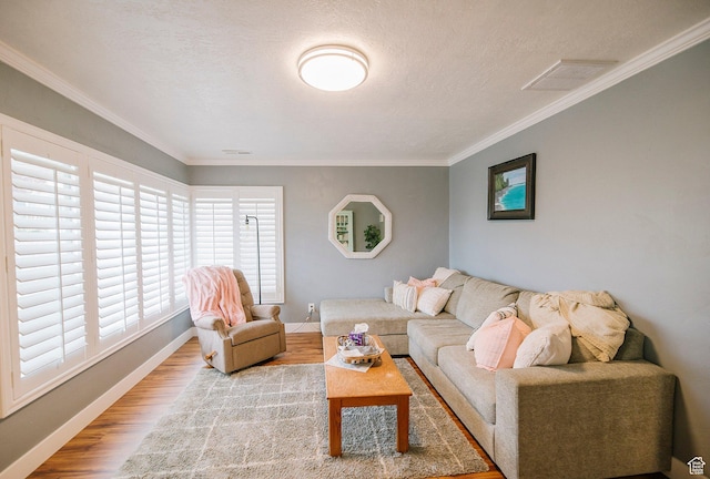 663 W 3500 S, Bountiful, UT 84010 - living room featuring visible vents, ornamental molding, wood finished floors, baseboards, and a textured ceiling