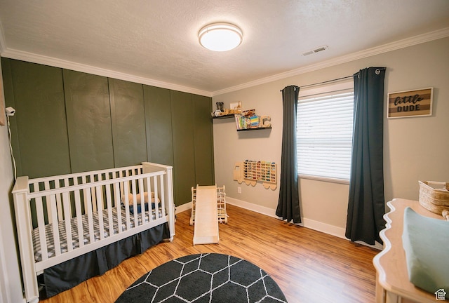 663 W 3500 S, Bountiful, UT 84010 - bedroom with baseboards, ornamental molding, light wood finished floors, and visible vents