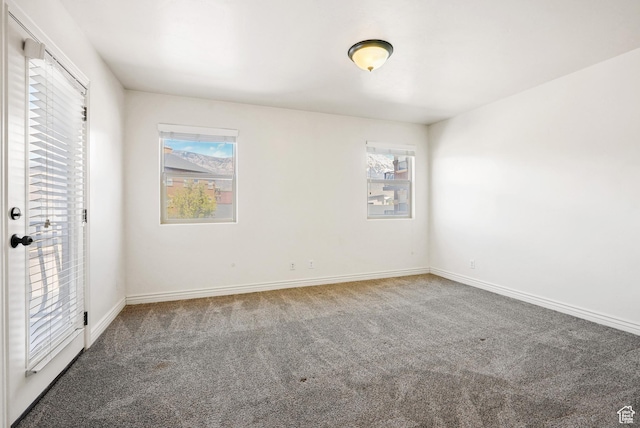 425 S 2220 W Unit 202, Pleasant Grove, UT 84062 - unfurnished bedroom featuring baseboards, multiple windows, carpet, and access to outside
