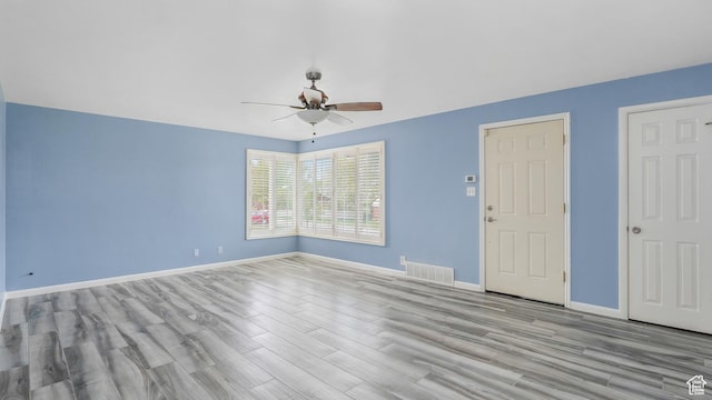 940 S Taylor E, Ogden, UT 84404 - empty room featuring visible vents, baseboards, ceiling fan, and wood finished floors