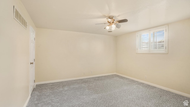 940 S Taylor E, Ogden, UT 84404 - spare room featuring carpet floors, ceiling fan, visible vents, and baseboards