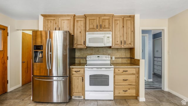 940 S Taylor E, Ogden, UT 84404 - kitchen featuring white appliances, light countertops, baseboards, decorative backsplash, and light tile patterned floors