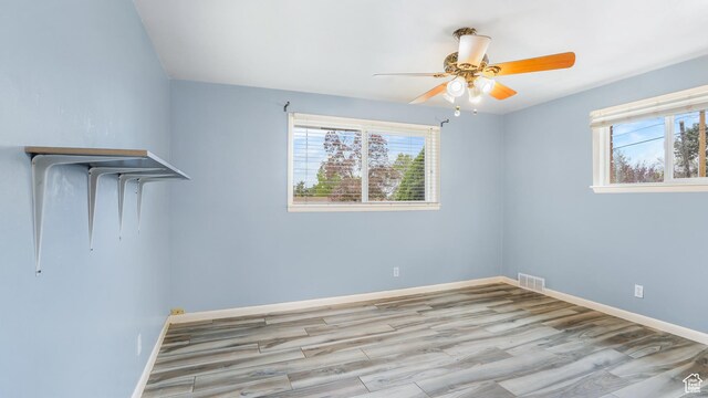 940 S Taylor E, Ogden, UT 84404 - interior space featuring plenty of natural light, a ceiling fan, wood finished floors, and visible vents