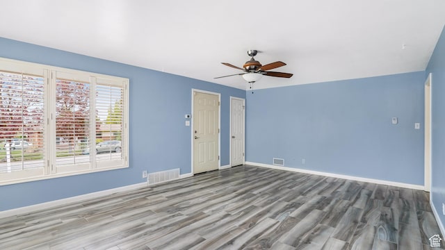 940 S Taylor E, Ogden, UT 84404 - empty room with baseboards, a ceiling fan, wood finished floors, and visible vents