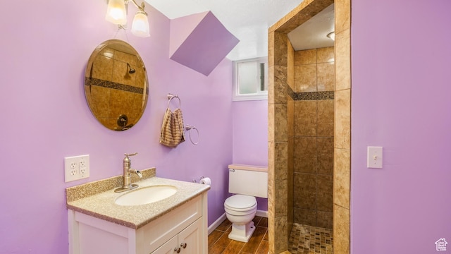 940 S Taylor E, Ogden, UT 84404 - bathroom with vanity, a tile shower, and toilet