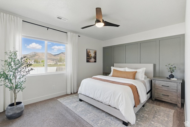 4236 N Magnolia Cir, Eagle Mountain, UT 84005 - bedroom with visible vents, light carpet, baseboards, ceiling fan, and a mountain view