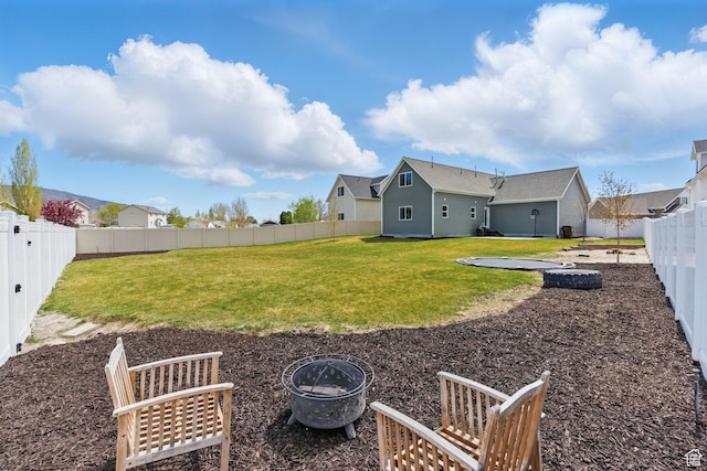 4236 N Magnolia Cir, Eagle Mountain, UT 84005 - view of yard with a fenced backyard and an outdoor fire pit