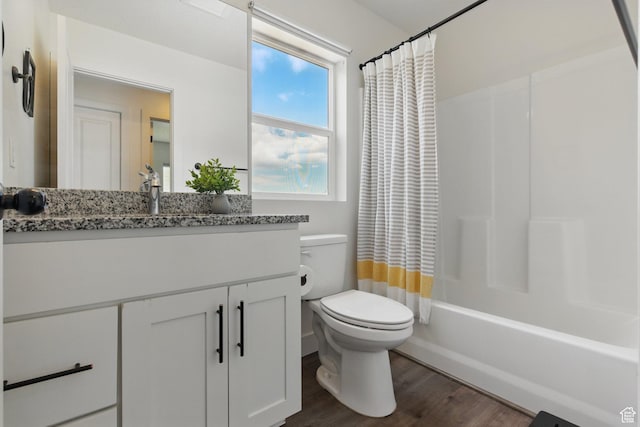 4236 N Magnolia Cir, Eagle Mountain, UT 84005 - bathroom featuring vanity, wood finished floors, shower / bath combo, and toilet