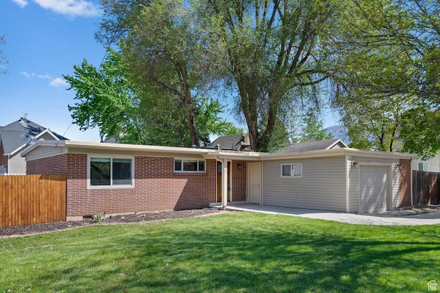 931 E 7800 S, Midvale, UT 84047 - ranch-style home featuring an attached garage, fence, a front yard, and brick siding