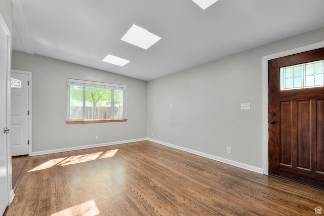 931 E 7800 S, Midvale, UT 84047 - entrance foyer featuring baseboards, lofted ceiling with skylight, and wood finished floors