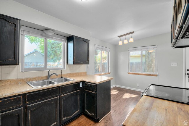 931 E 7800 S, Midvale, UT 84047 - kitchen with a sink, tasteful backsplash, and a wealth of natural light