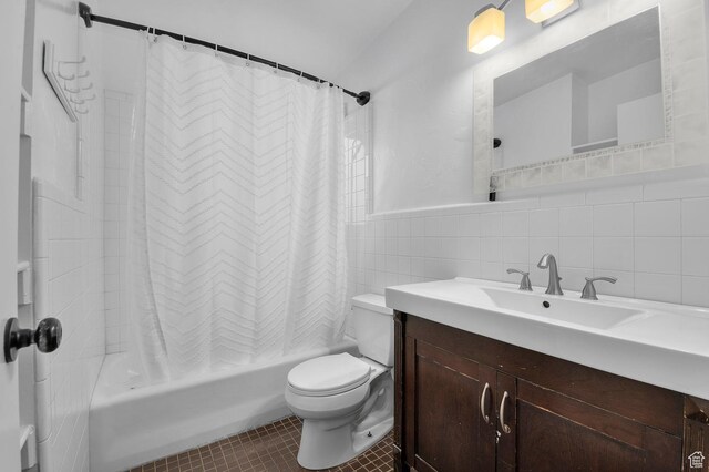 931 E 7800 S, Midvale, UT 84047 - full bathroom featuring tile patterned flooring, vanity, toilet, tile walls, and shower / tub combo
