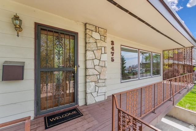 3475 S 3650 E, Millcreek, UT 84109 - doorway to property with covered porch and stone siding