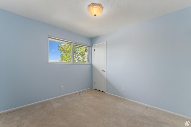 3475 S 3650 E, Millcreek, UT 84109 - unfurnished room featuring baseboards, visible vents, and light carpet