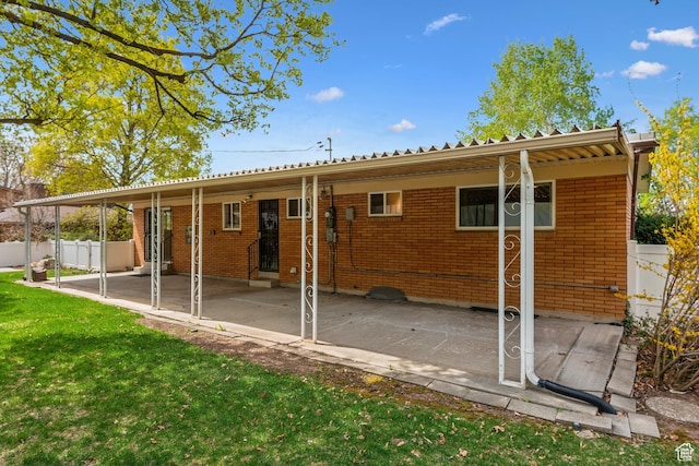 3475 S 3650 E, Millcreek, UT 84109 - back of house featuring a lawn, fence, entry steps, and brick siding