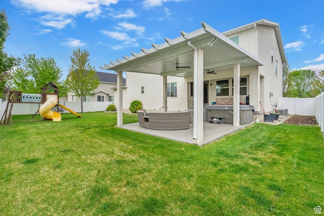 145 W 750 S, American Fork, UT 84003 - back of house featuring a hot tub, stucco siding, a fenced backyard, a patio area, and a ceiling fan