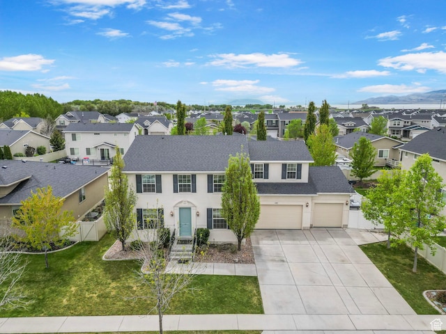 145 W 750 S, American Fork, UT 84003 - view of front of house featuring a residential view, fence, a shingled roof, a front yard, and driveway