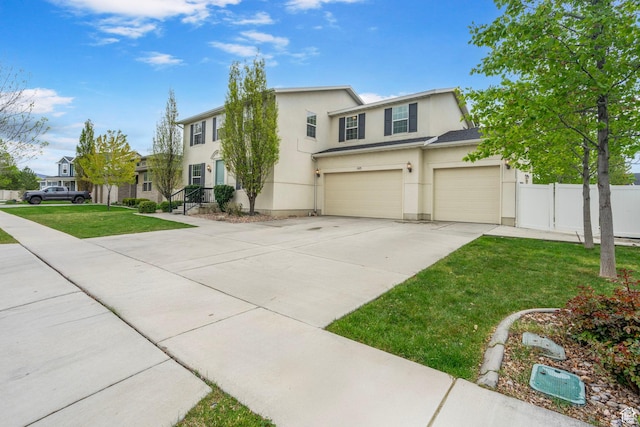 145 W 750 S, American Fork, UT 84003 - view of front of house featuring fence, an attached garage, stucco siding, a front yard, and driveway
