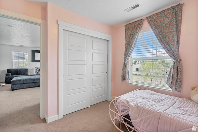 145 W 750 S, American Fork, UT 84003 - bedroom featuring visible vents, a textured ceiling, baseboards, and light carpet