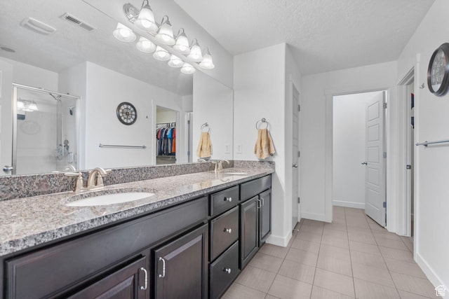 145 W 750 S, American Fork, UT 84003 - bathroom with a sink, a stall shower, double vanity, and visible vents