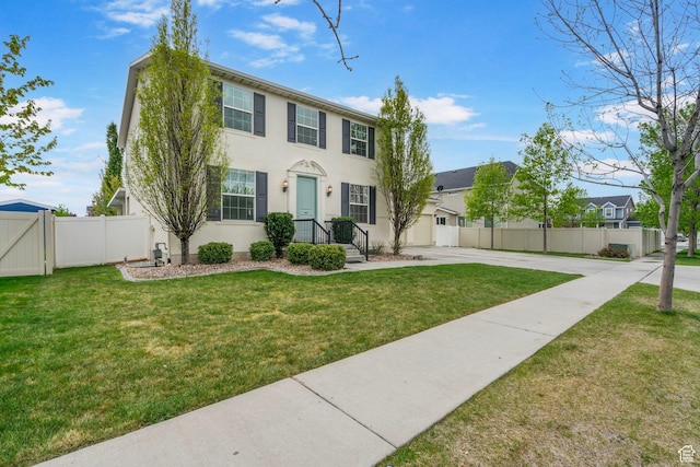 145 W 750 S, American Fork, UT 84003 - colonial-style house featuring fence, stucco siding, concrete driveway, and a front yard