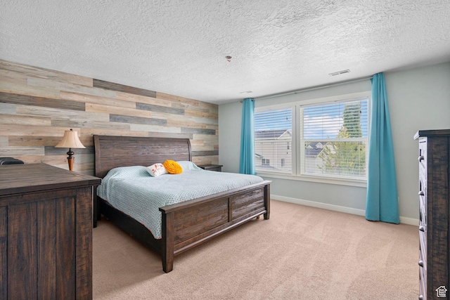 145 W 750 S, American Fork, UT 84003 - bedroom featuring visible vents, baseboards, wooden walls, light colored carpet, and a textured ceiling