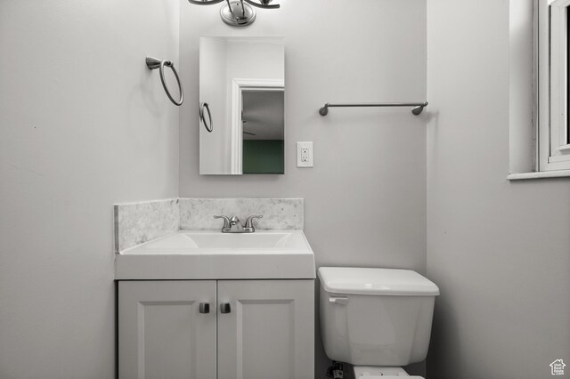 3581 E Yosemite Dr S, Millcreek, UT 84109 - half bath featuring vanity and toilet