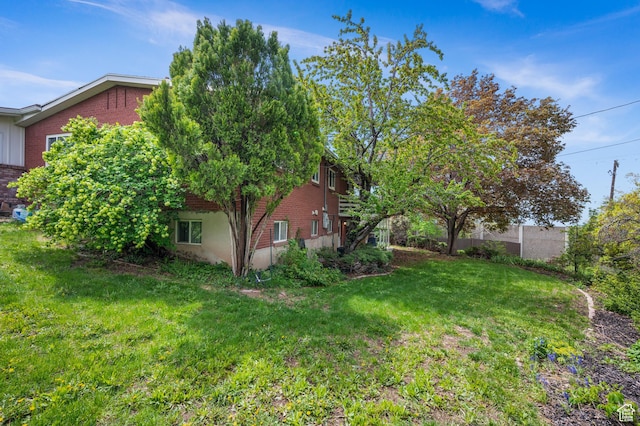 3581 E Yosemite Dr S, Millcreek, UT 84109 - view of green lawn with an attached garage