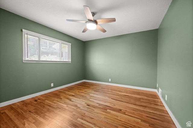 3581 E Yosemite Dr S, Millcreek, UT 84109 - unfurnished room with a ceiling fan, wood finished floors, and baseboards