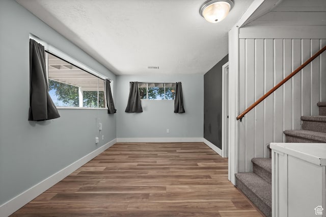 3581 E Yosemite Dr S, Millcreek, UT 84109 - stairs featuring baseboards and wood finished floors