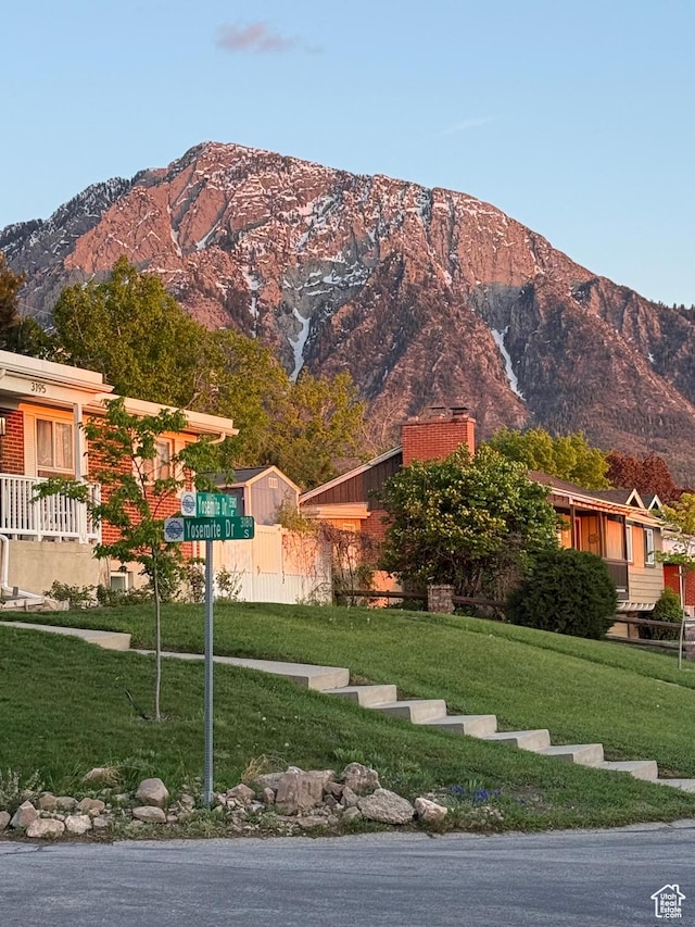 3581 E Yosemite Dr S, Millcreek, UT 84109 - view of front facade featuring a mountain view, a front yard, and a chimney