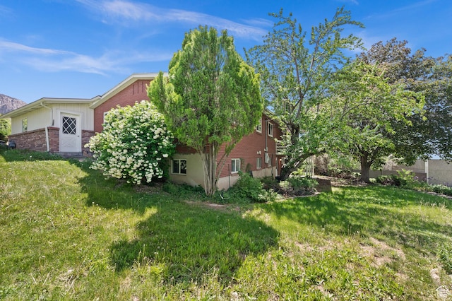 3581 E Yosemite Dr S, Millcreek, UT 84109 - view of side of property with brick siding and a yard