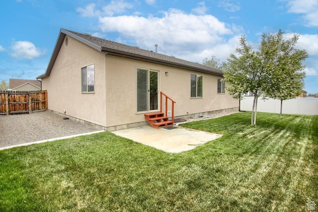 566 N 640 W, Tooele, UT 84074 - back of property featuring a patio, a fenced backyard, entry steps, and stucco siding