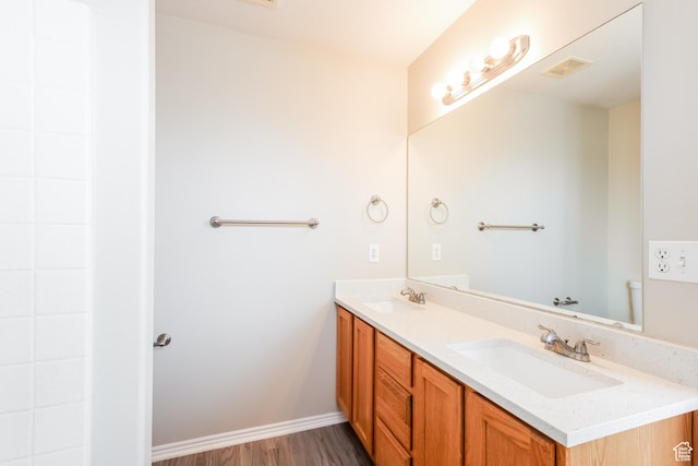 4018 W 5250 S, Roy, UT 84067 - bathroom with visible vents, a sink, wood finished floors, and double vanity