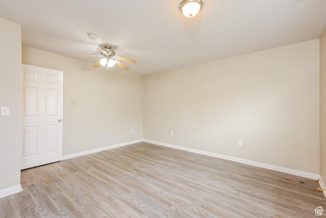 4018 W 5250 S, Roy, UT 84067 - empty room featuring light wood-style floors, a ceiling fan, and baseboards