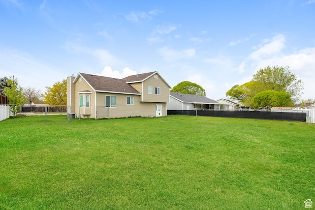 4018 W 5250 S, Roy, UT 84067 - exterior space with a lawn, a chimney, and a fenced backyard