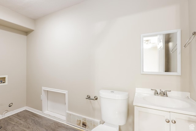 4018 W 5250 S, Roy, UT 84067 - bathroom featuring visible vents, wood finished floors, toilet, and vanity