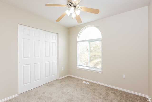 4018 W 5250 S, Roy, UT 84067 - unfurnished bedroom featuring visible vents, carpet floors, a closet, baseboards, and ceiling fan