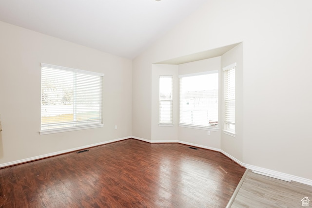 4018 W 5250 S, Roy, UT 84067 - unfurnished room featuring baseboards, visible vents, wood finished floors, and lofted ceiling