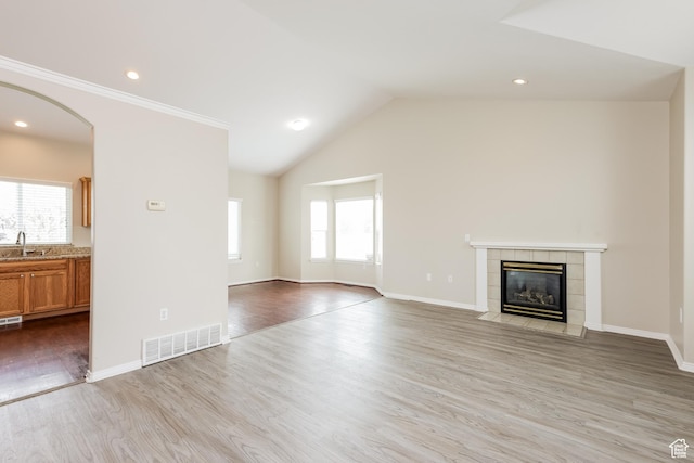 4018 W 5250 S, Roy, UT 84067 - unfurnished living room with a sink, visible vents, plenty of natural light, and light wood-style flooring