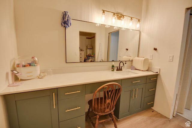 bathroom with vanity and wood finished floors