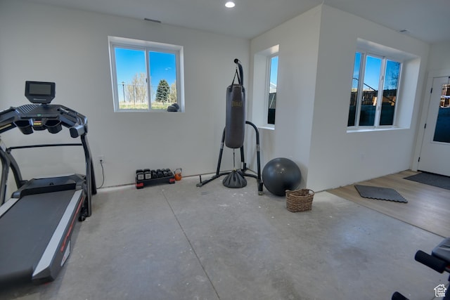 exercise room featuring recessed lighting and plenty of natural light