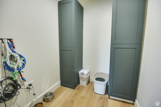 room details with baseboards and wood finished floors