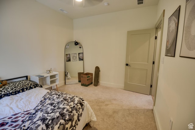 bedroom featuring visible vents, carpet flooring, baseboards, and a ceiling fan
