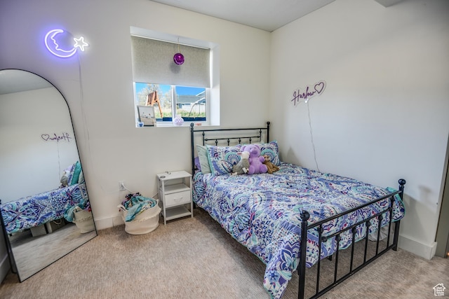 carpeted bedroom with baseboards